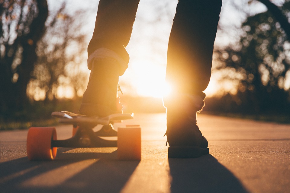 Skate boarder at sunset.