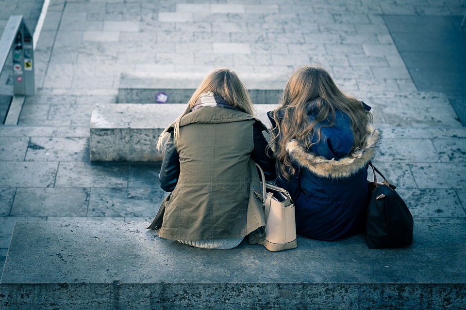 Two friends sitting together.